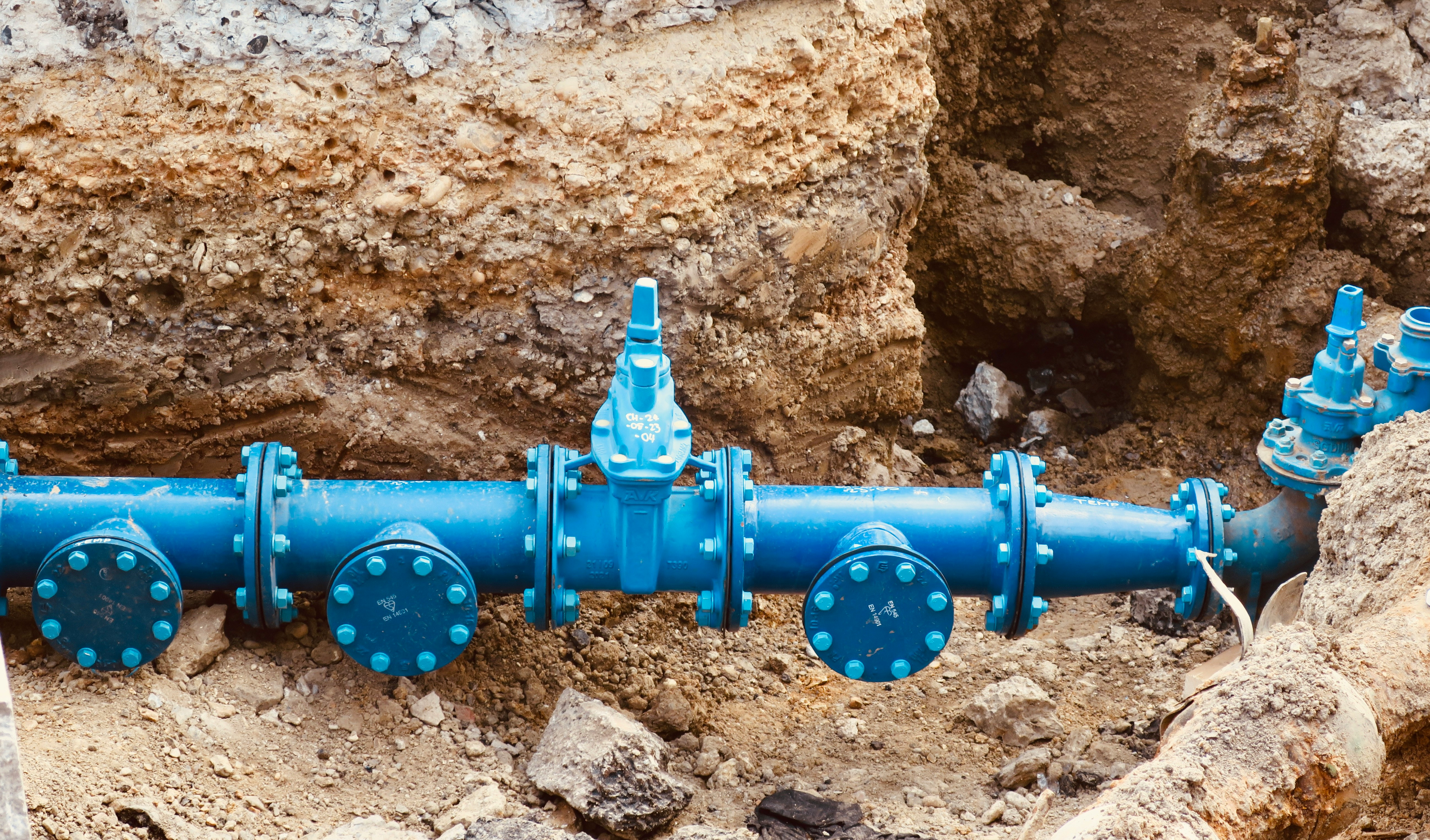 Water main pipe installation in an excavation trench