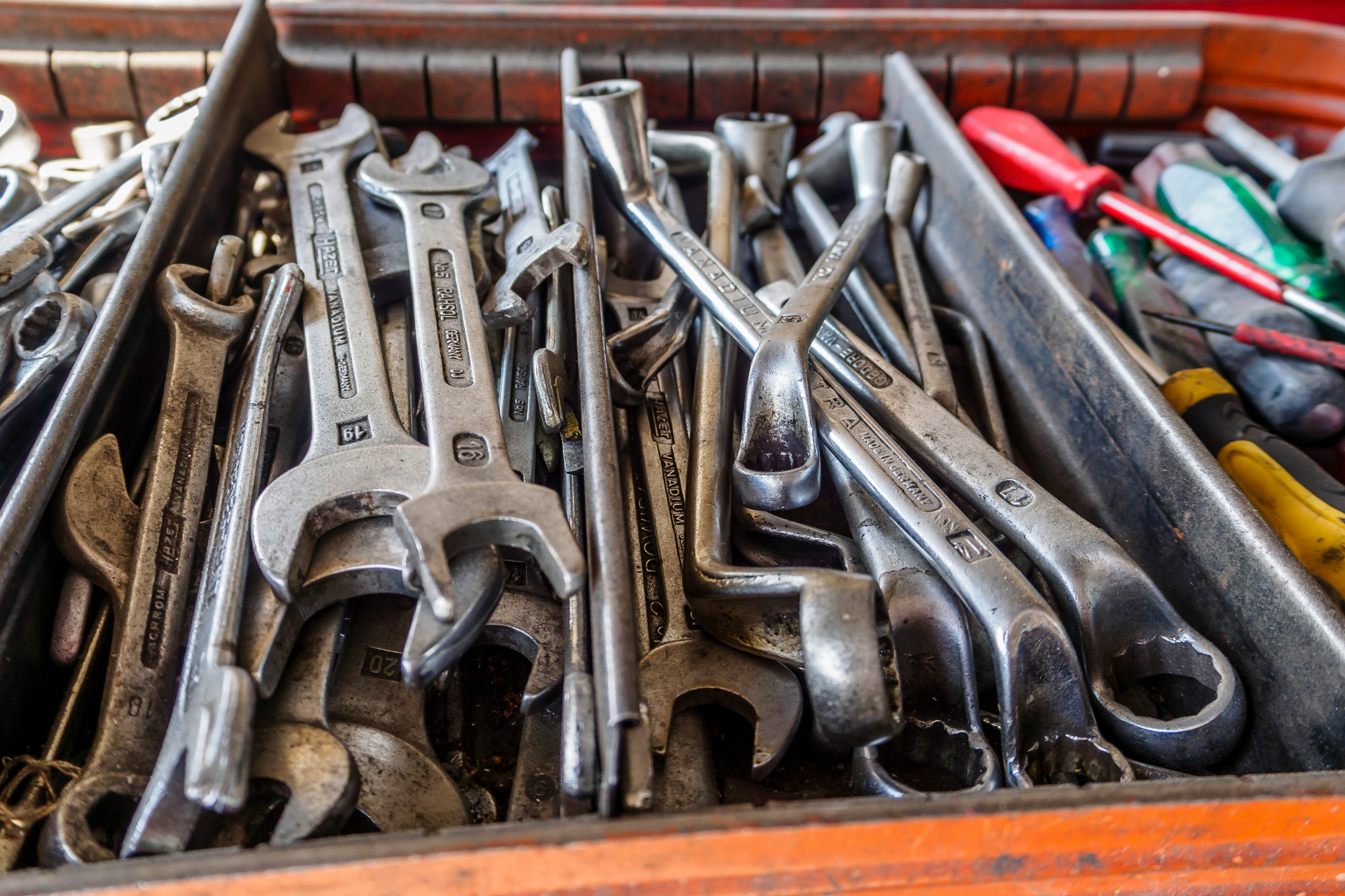 Plumbing toolbox with wrenches and hand tools